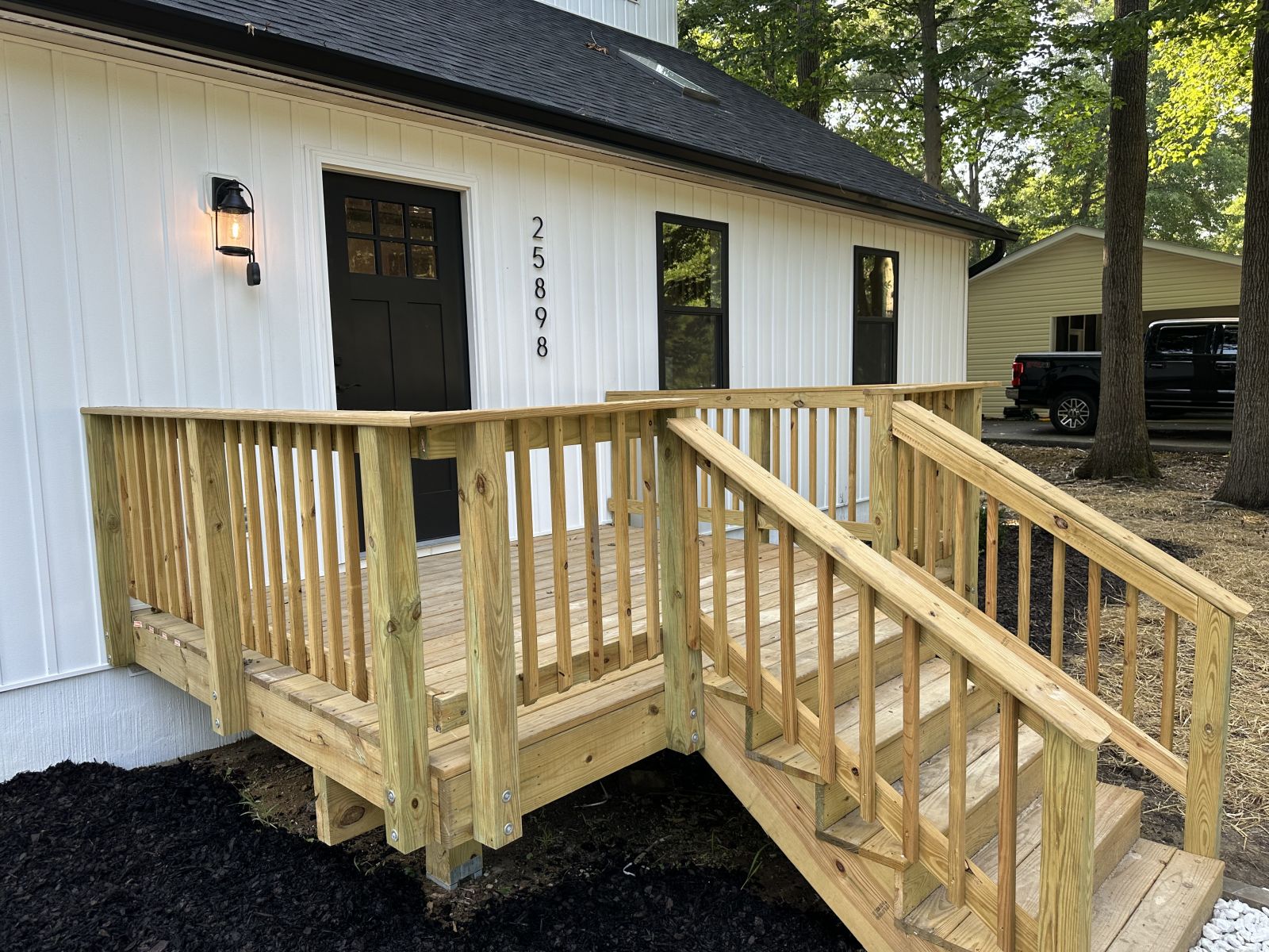 New wooden deck installed by Priority Exterior Solutions